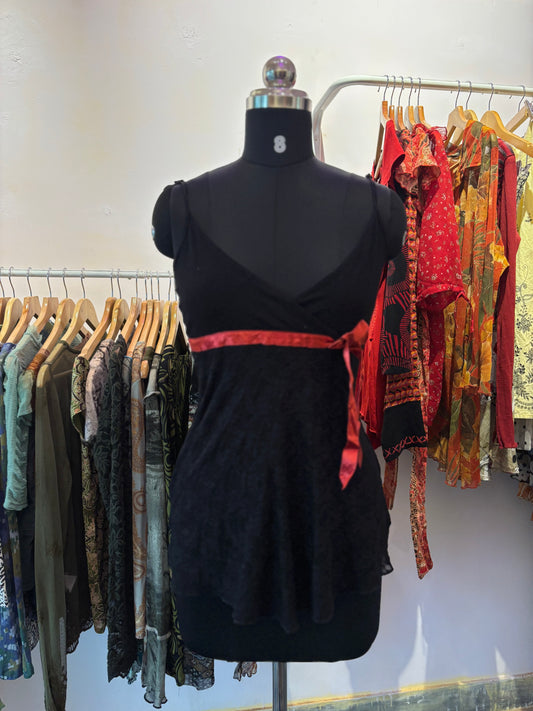 Black lacy top with red ribbon
