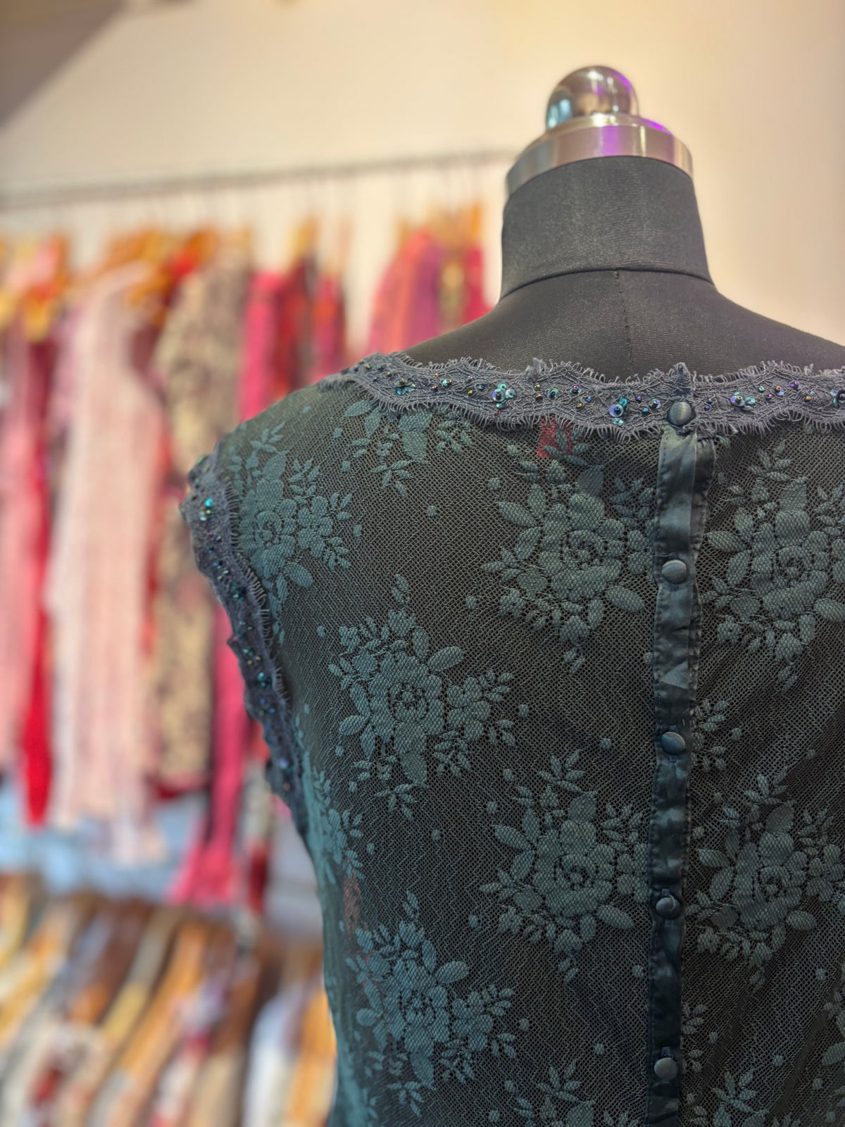 Deep green lace top with sequins details
