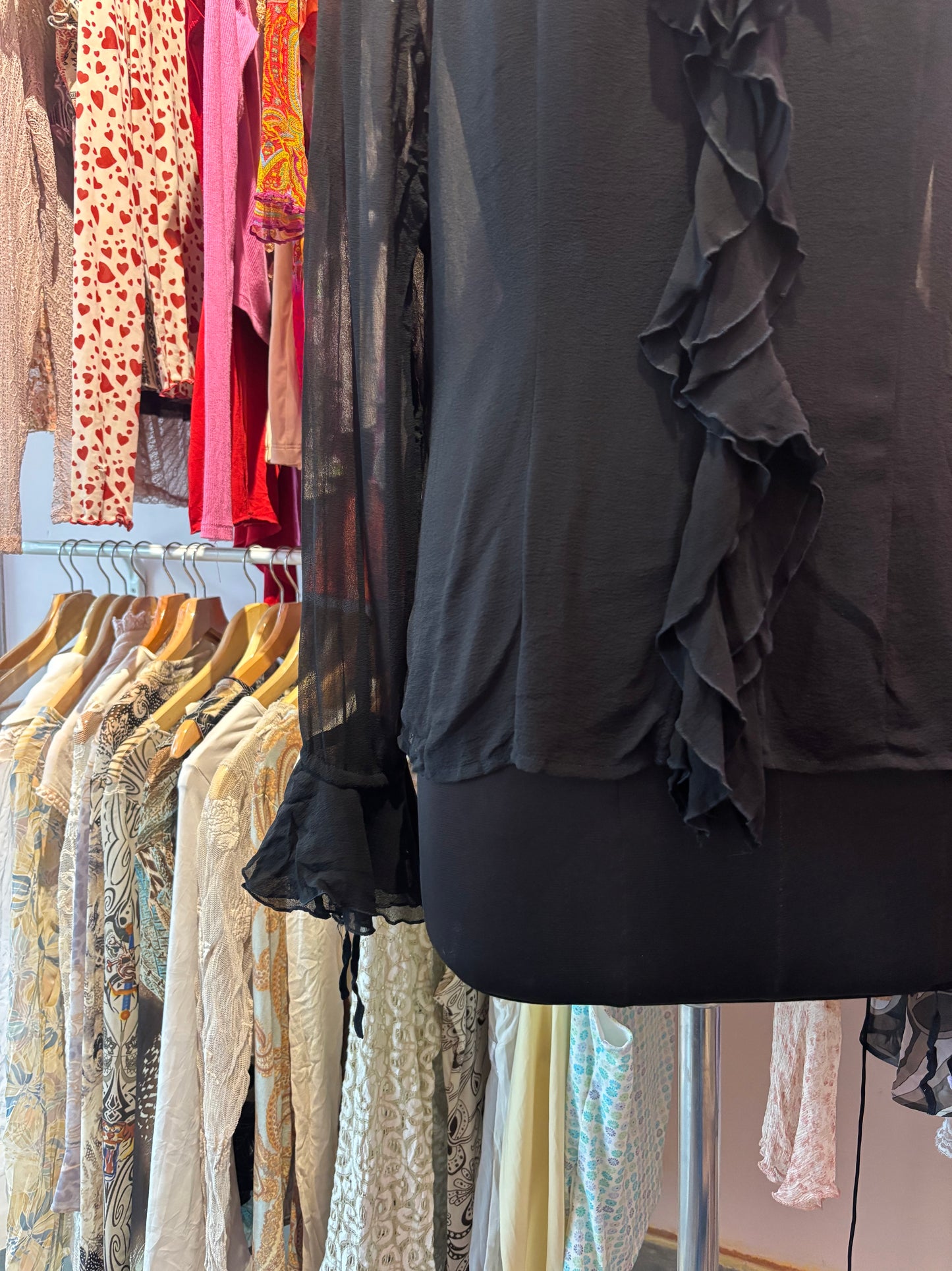 Black ruffle neck