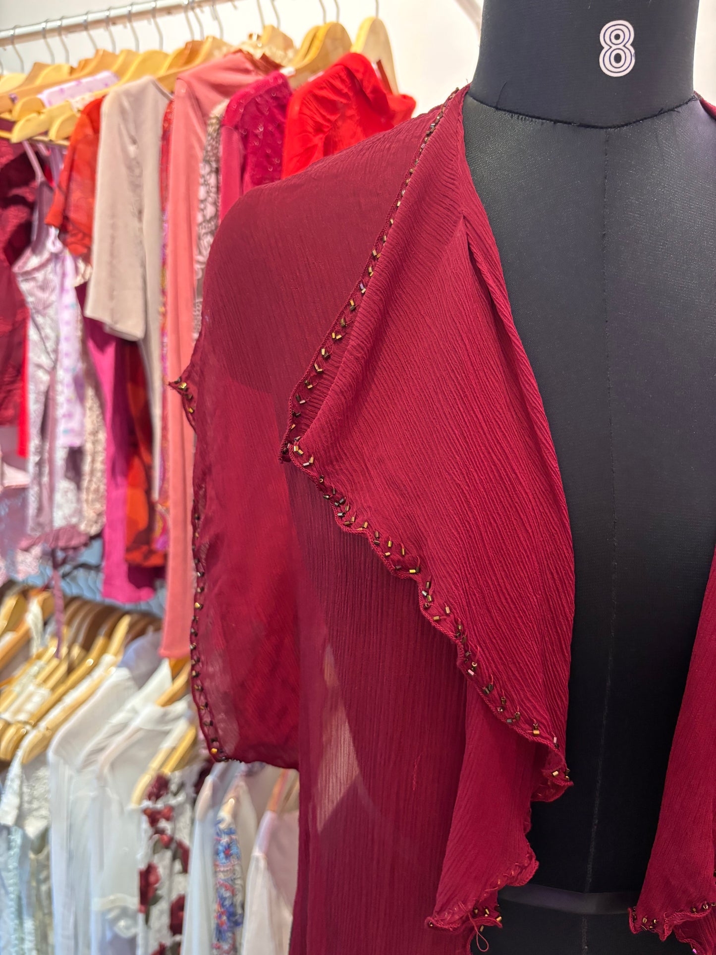 Red silk overwear with bead details