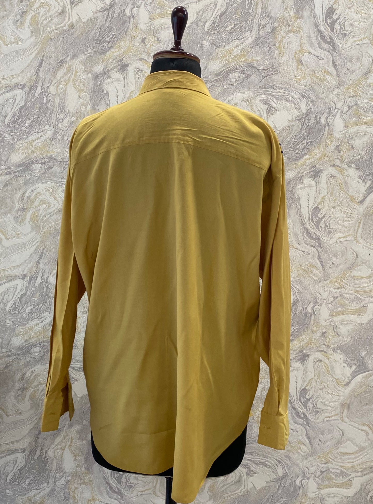 Mustard shirt with work on the shoulders