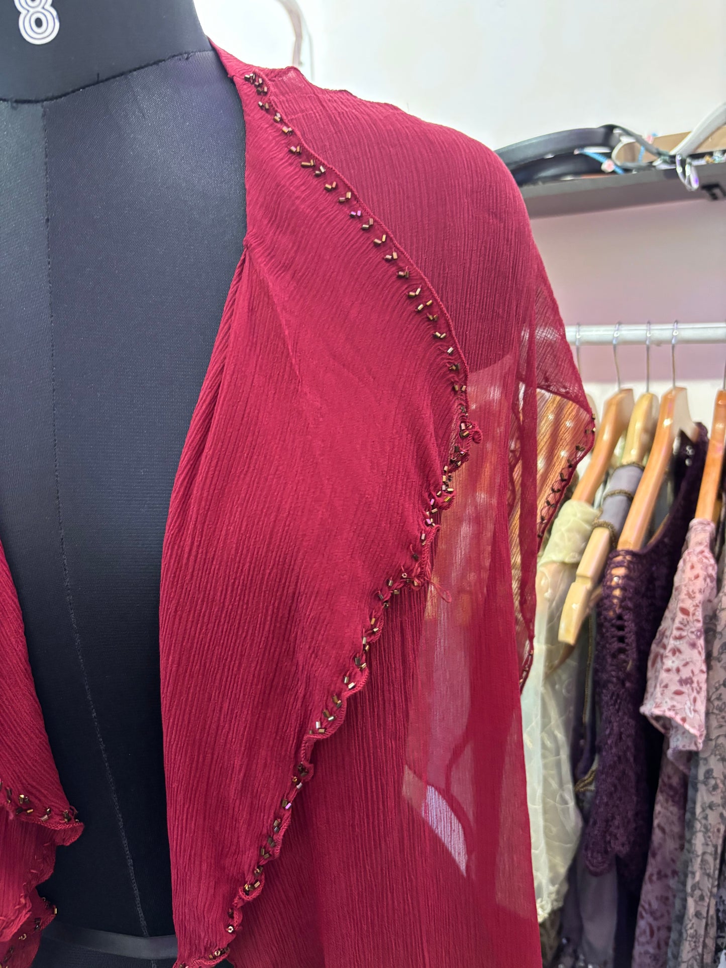 Red silk overwear with bead details