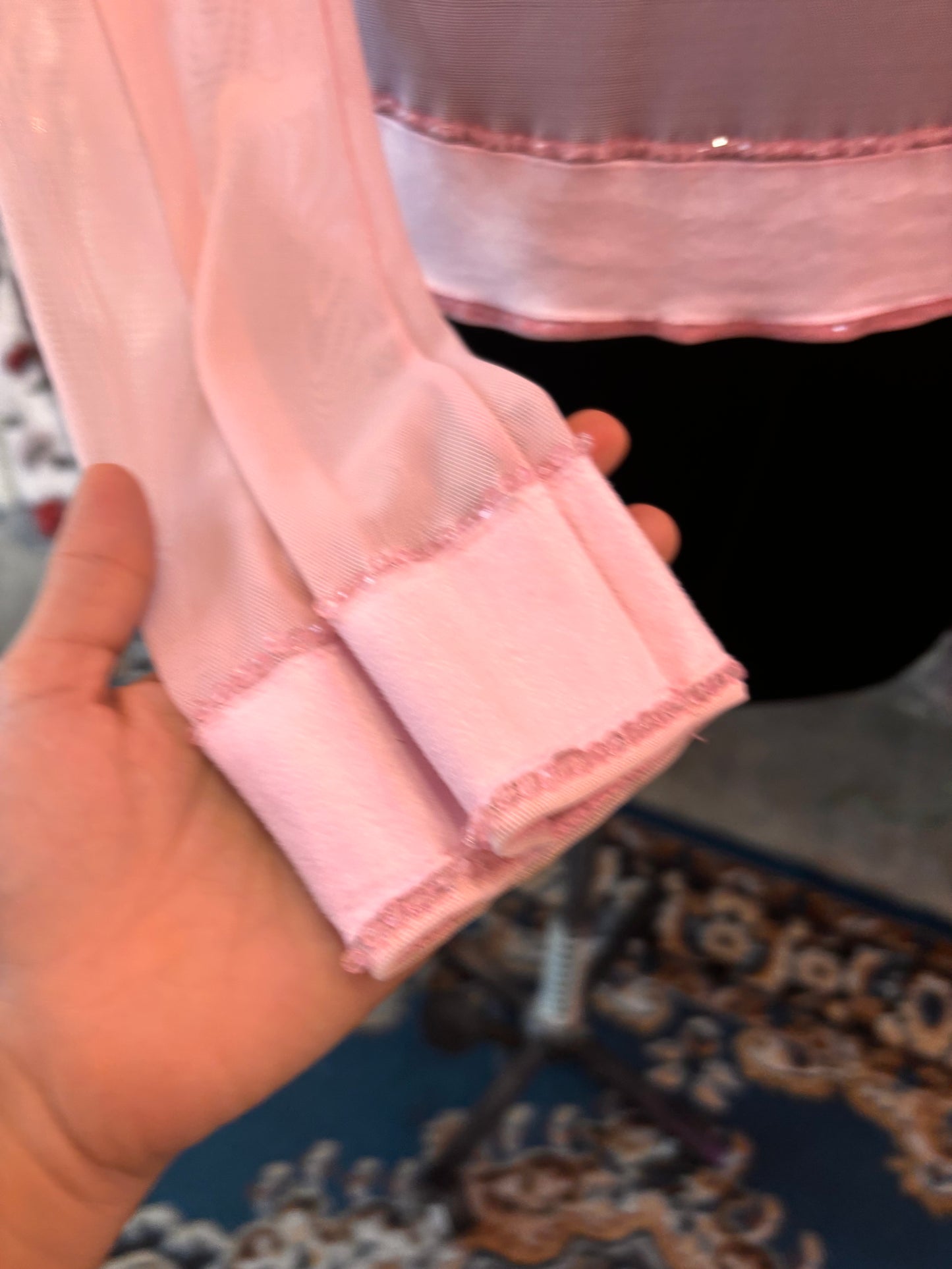 Diana’s pink top
