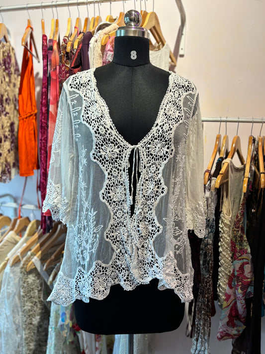 Crochet overwear with peacock motif