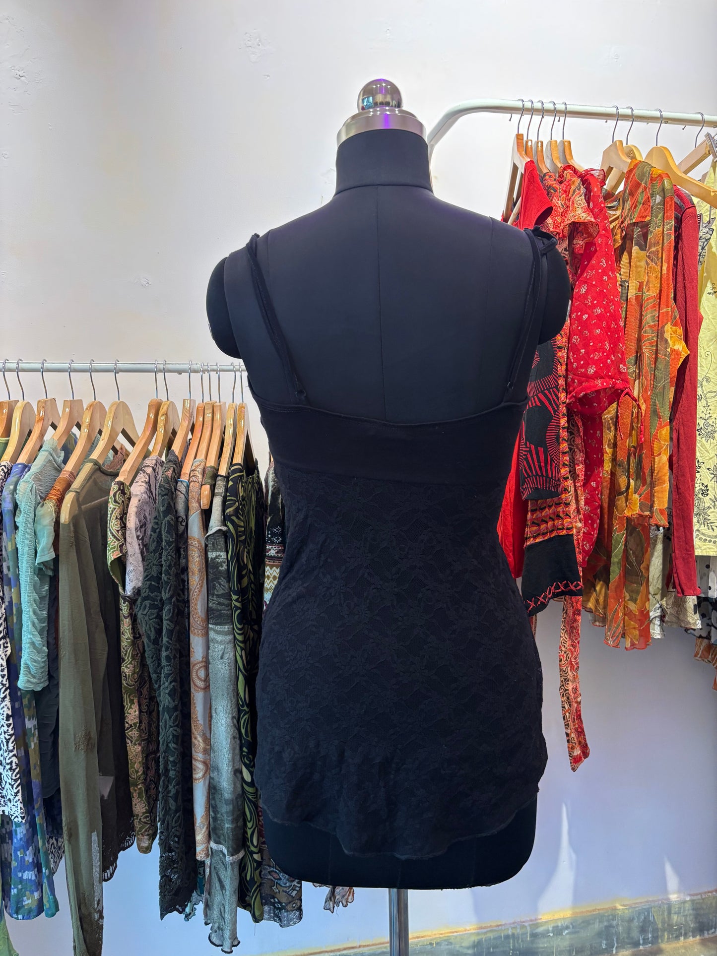Black lacy top with red ribbon