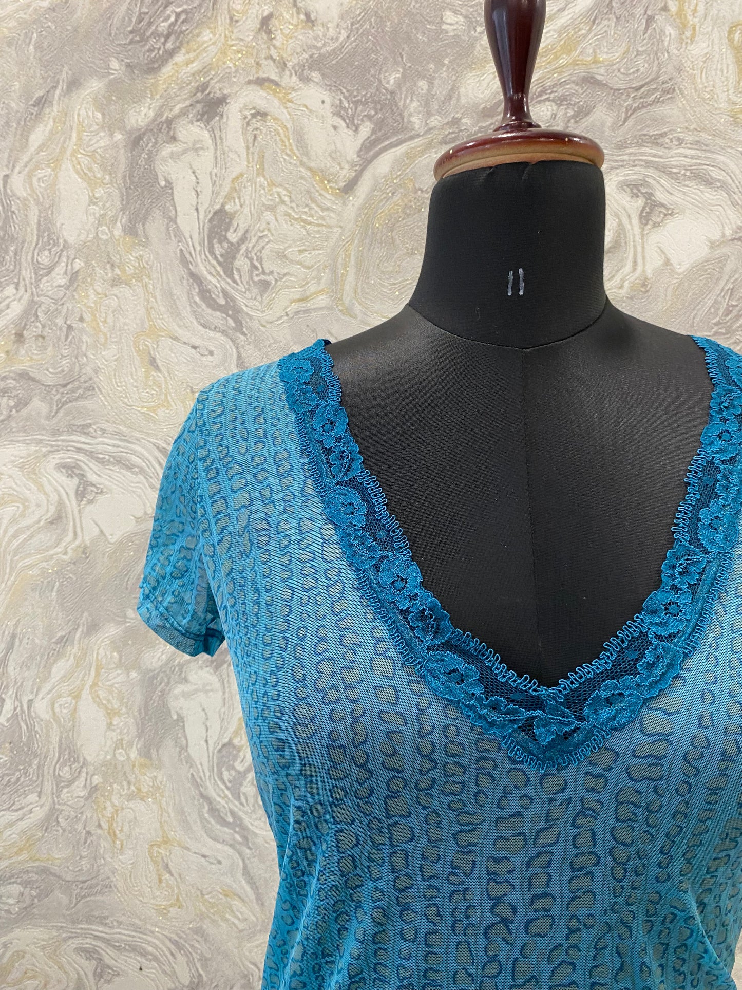 Cheetah print top with lacy neckline