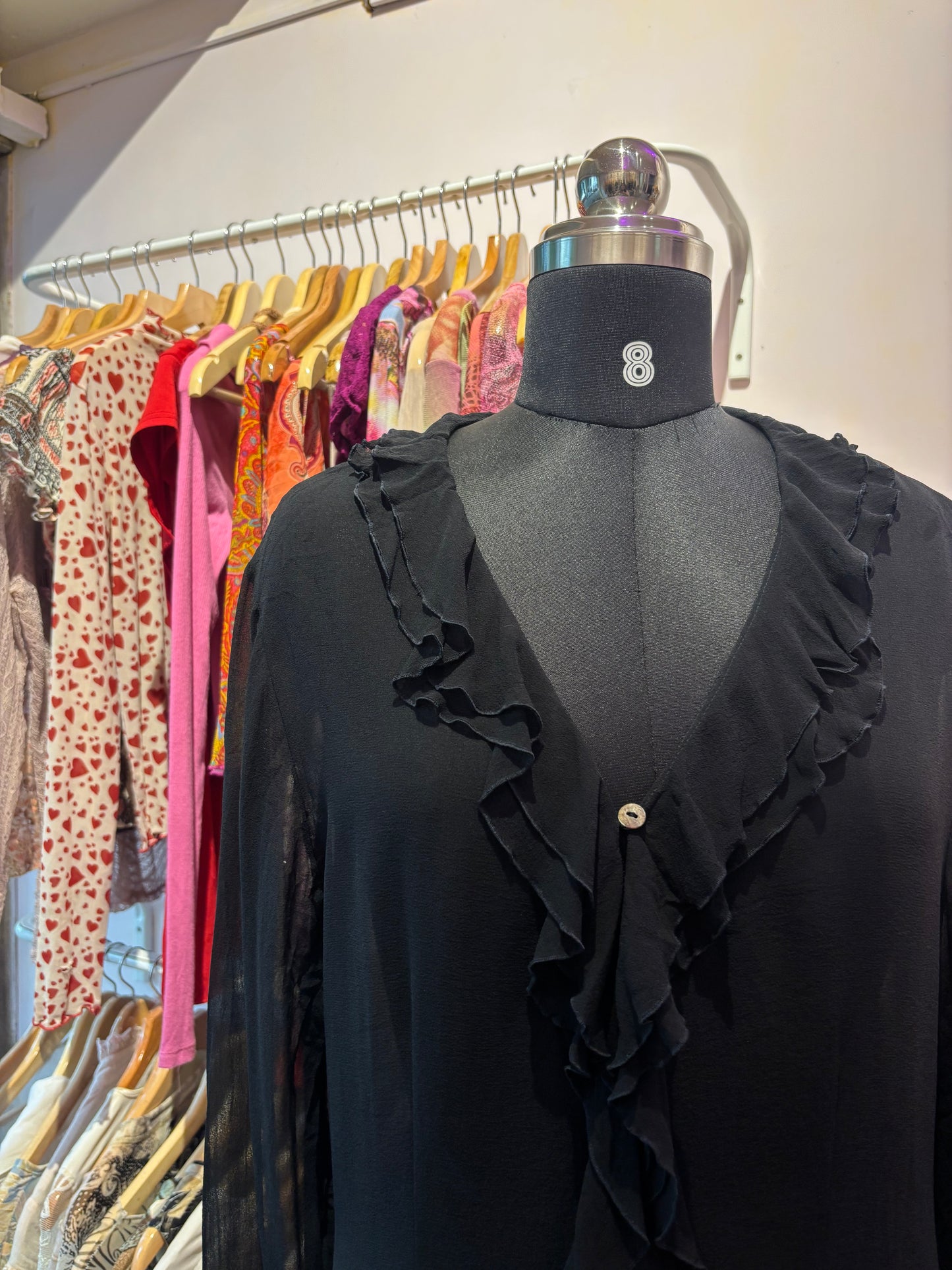 Black ruffle neck