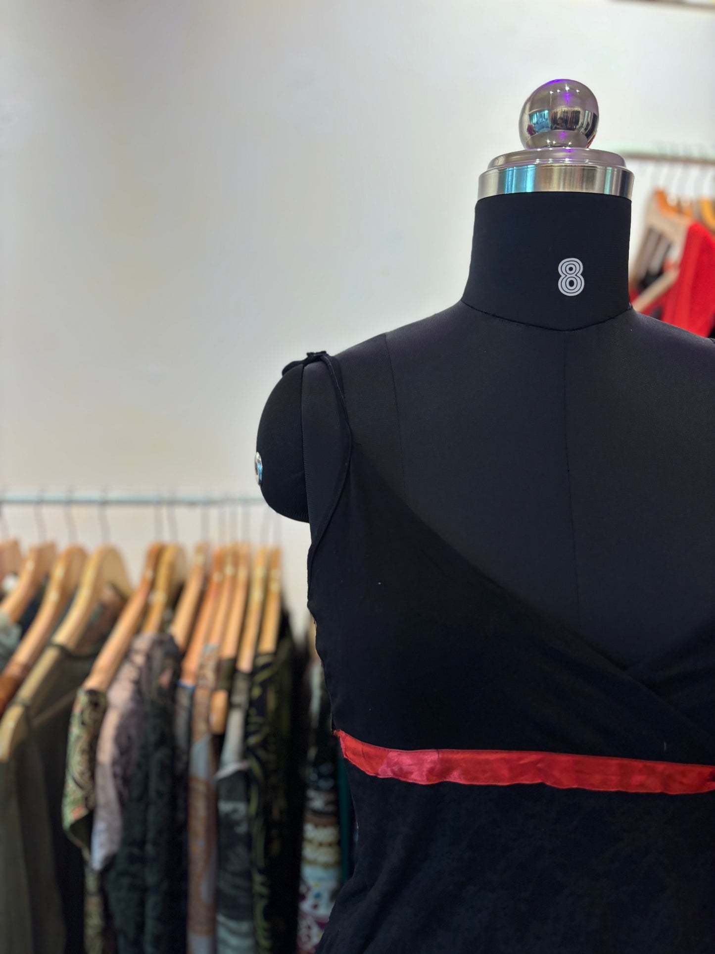 Black lacy top with red ribbon
